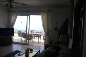A television and/or entertainment centre at Stunning Views Mirador de Mijas Apt