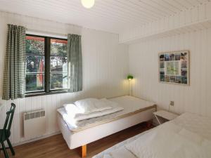 Postel nebo postele na pokoji v ubytování Holiday Home Jale - 50m from the sea by Interhome + 10 fotografií