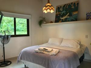 a bedroom with a bed with a towel on it at La Nube - San Lorenzo in San Lorenzo