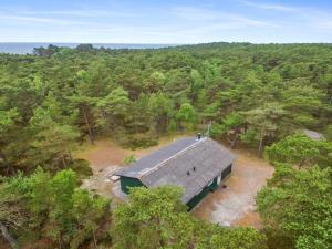 an overhead view of a building in the middle of a forest at Holiday Home Kim - 300m from the sea in Bornholm in Vester Sømarken