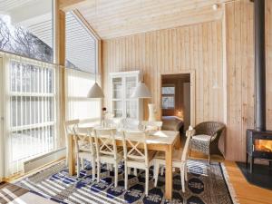 a dining room with a table and chairs at Holiday Home Sakarias - 800m from the sea by Interhome in Hasle +14 photos