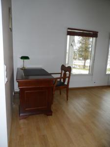a room with a desk and a chair and a window at Klaukkala apartment in Klaukkala