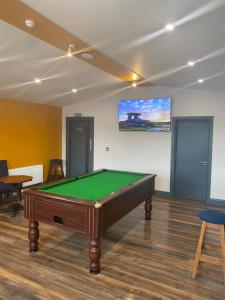 a room with a pool table in a room at The Burren Inn in Tubber