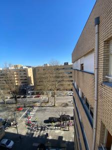a view of a parking lot next to a building at Apartamento Central in Braga