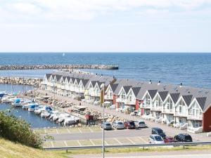 a marina with rows of houses and cars parked at Holiday Home Momo - 10m from the sea in Bornholm by Interhome in Hasle