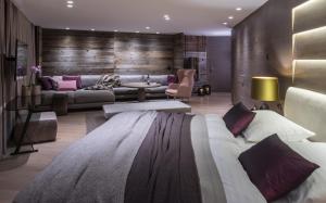 a living room with a large bed and a couch at ElisabethHotel Premium Private Retreat- Adults only in Mayrhofen