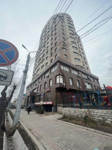 a tall building on the side of a street at 3-room apartment on Baytik-Baatyr 37 in Bishkek