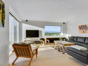 a living room with a couch and a table at Holiday Home Ermelinda - 900m to the inlet by Interhome in Nordborg +36 photos