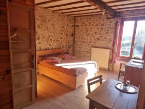 Postel nebo postele na pokoji v ubytování Chambres et Table d'hôtes Il Fut Un Temps...