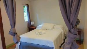 En eller flere senge i et værelse på Estrela da noite