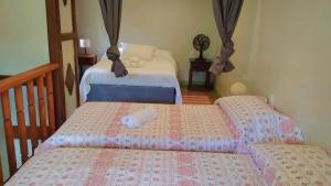 En eller flere senge i et værelse på Estrela da noite + 33 billeder