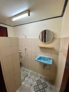 a bathroom with a blue sink and a mirror at Ratanawong Place 552 in Bangkok +13 photos