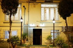 a building with two lights and plants in front of it at Bonita Apart in Istanbul