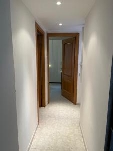 an empty hallway with a door and a room at Red house in Monteverde - Zen Real Estate in Rome