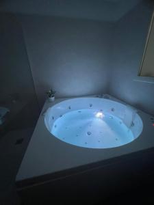 a jacuzzi tub in a corner of a room at Samcri Luxury Home in Catania