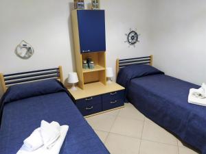 A bed or beds in a room at SanvitoTour - Le Terrazze