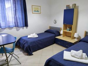 A bed or beds in a room at SanvitoTour - Le Terrazze