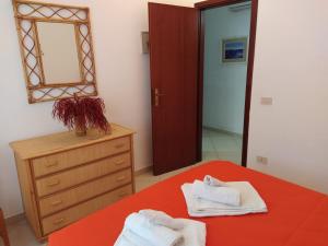 A bed or beds in a room at SanvitoTour - Le Terrazze