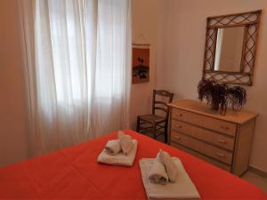A bed or beds in a room at SanvitoTour - Le Terrazze