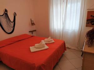 A bed or beds in a room at SanvitoTour - Le Terrazze
