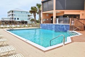a large swimming pool in front of a building at Broadmoor 304 in Orange Beach