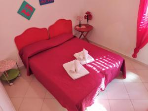 A bed or beds in a room at SanvitoTour - Le Terrazze