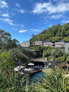 a bridge over a river with buildings in the background at 9309 Tranquil Viridian 2 Bedroom Luxury in Noosa Heads