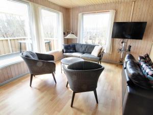a living room with a couch and chairs at Holiday Home Svanhild - 1-2km from the sea in Western Jutland by Interhome in Fanø