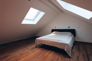 a bedroom with a bed and a large window at Eifel 2.0 in Bad Münstereifel