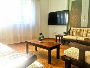 a living room with a couch and a table at EstellApartments in Athens