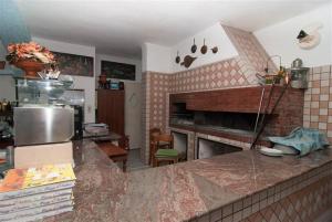 Kuchyň nebo kuchyňský kout v ubytování Hotel La Ninfea