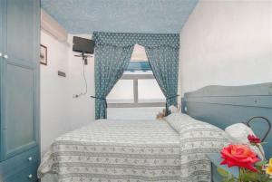 Postel nebo postele na pokoji v ubytování Hotel La Ninfea