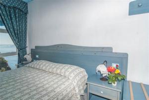 Postel nebo postele na pokoji v ubytování Hotel La Ninfea