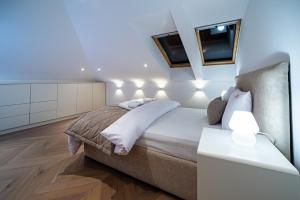 Posteľ alebo postele v izbe v ubytovaní Apartamenty Rynek 7 by Hotel Żywiecki****