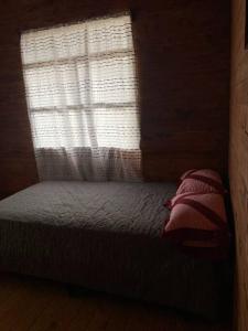 Una cama o camas en una habitación de Cabaña Mariposa Cometa – Living IN THE clouds!