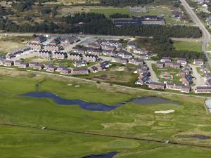 an aerial view of a resort with a golf course at Apartment Helvig - 2-3km from the sea in Western Jutland by Interhome in Sønderby