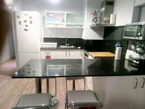 Kuchyň nebo kuchyňský kout v ubytování Apartamento playa