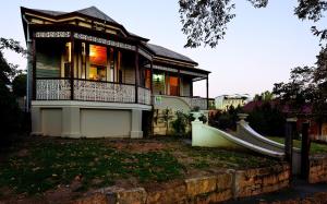 a house with a balcony on top of it at Cobb&CoHouse-Goldfields ExecutiveStay Ideal for Families &Work Crews in Bendigo