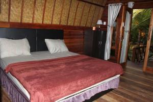 Postel nebo postele na pokoji v ubytování Bronze Bungalows
