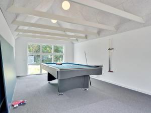 a large room with a pool table in it at Holiday Home Allin - 1km from the sea in Western Jutland by Interhome in Mølby