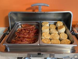 a tray of meat and pastries in a buffet at Urban Boutique Hotel; BW Signature Collection in Greenville