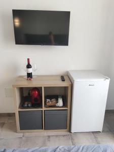 a small table next to a white refrigerator at Casa Leya Los Cristianos in Arona