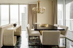a dining room with a table and chairs at 2 Bedroom with stunning views at the W residences in Miami