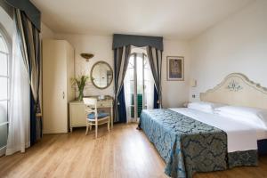 Postel nebo postele na pokoji v ubytování Hotel Goya