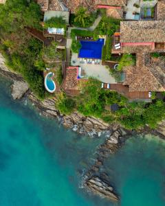 an aerial view of a house on the beach at Insólito Boutique Hotel & Spa in Búzios