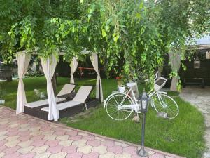 two bikes parked under a gazebo in a yard at ANITA B19 LUXORY Apartment Sunny Beach in Sunny Beach