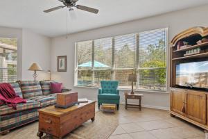 a living room with a couch and a tv at Sunset Pass in Middleburg +42 photos