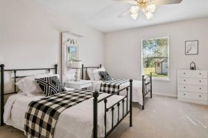 a bedroom with two beds and a ceiling fan at Sunset Pass in Middleburg