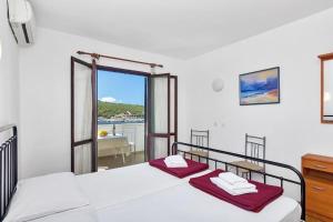 Postel nebo postele na pokoji v ubytování Apartments Igor