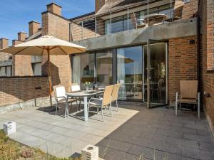 A patio or other outdoor area at Apartment Helgo - 250m from the sea in Western Jutland by Interhome